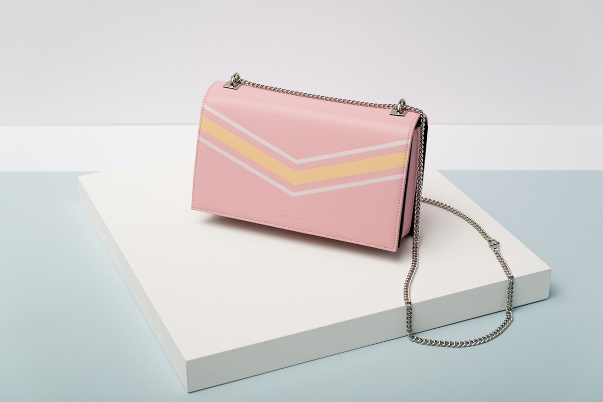 Lavie Structured Geometric Party Clutch with Chain in Champagne Metallic Glitter